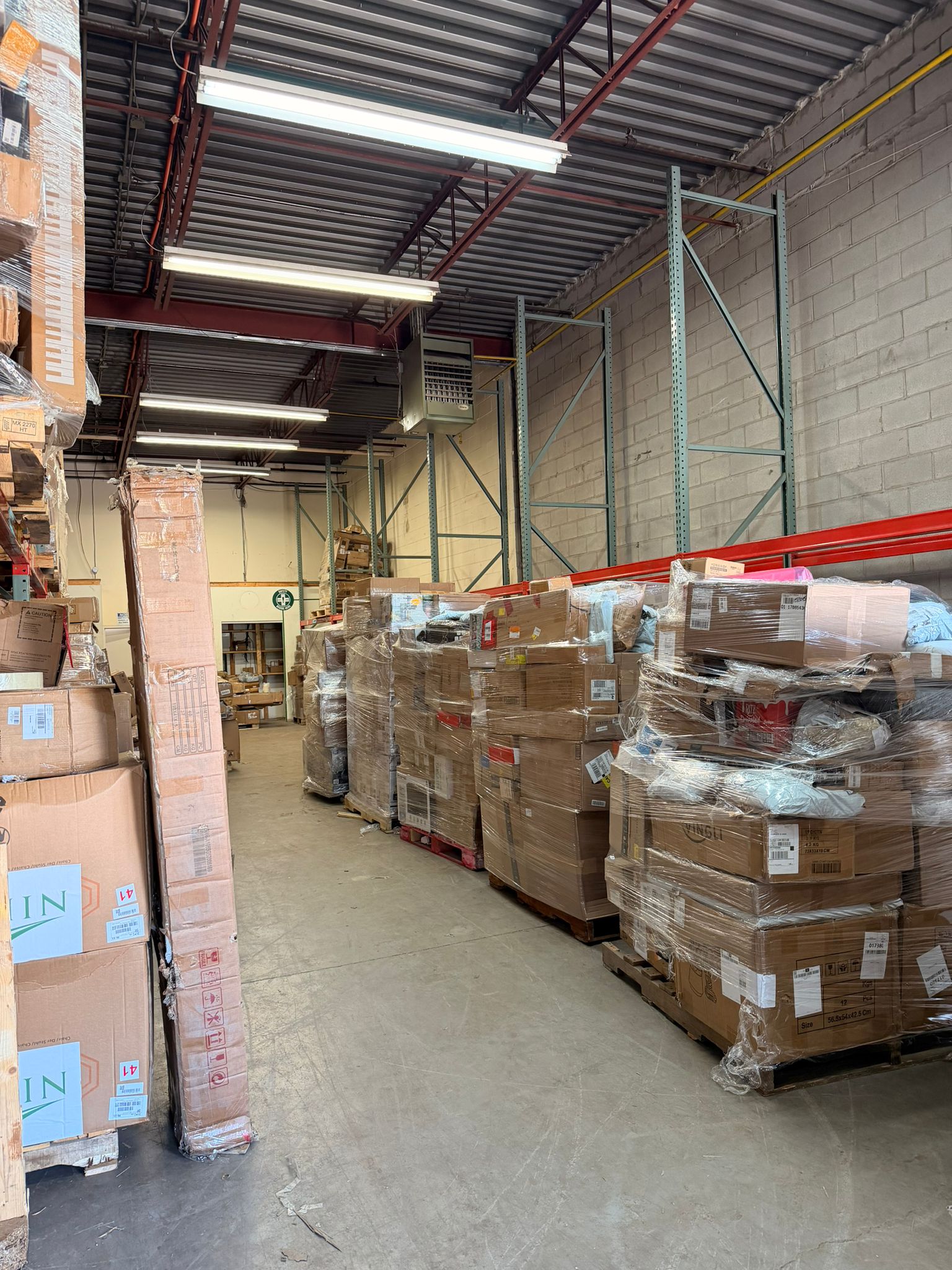Warehouse aisle with wrapped pallets